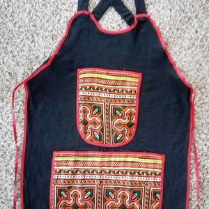 One of a kind Apron. Beautiful, eye-catching embroidery. Pockets in the front.